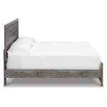 Bronyan King Panel Bed, Dresser, Mirror, Chest and 2 Nightstands - Image 10