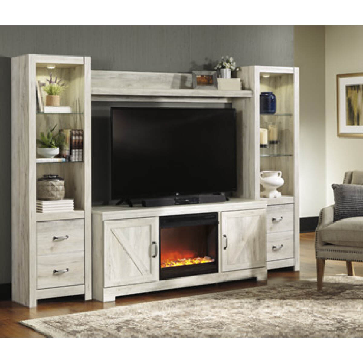 f328f51162c163bac22e01fda139a32e Bellaby 4-Piece Entertainment Center with Fireplace - Image 1